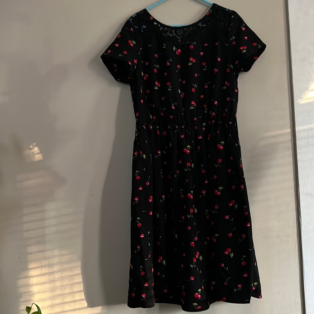 Black dress with cherrys on it girls large 10/12